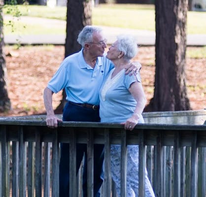 Senior couple sharing a tender moment outdoors