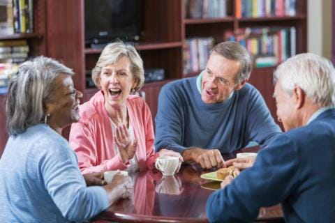 Group of residents enjoying a conversation at a table