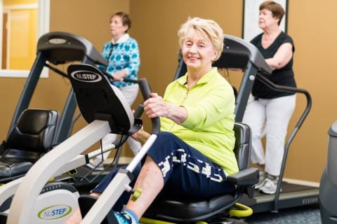 Residents exercising in a fitness room