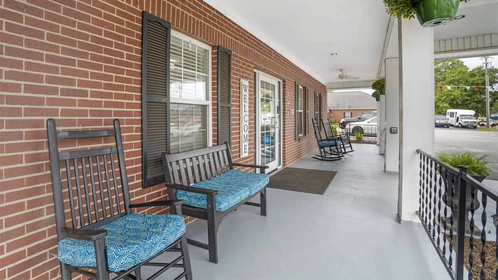 Outdoor seating area with rocking chairs