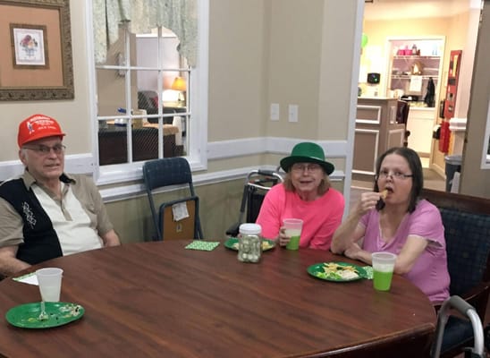 Residents enjoying snacks at a communal table
