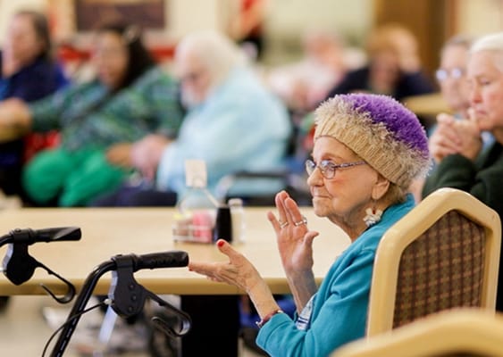Residents engaged in a group setting at the facility