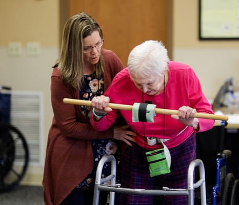Staff assisting a resident with mobility training