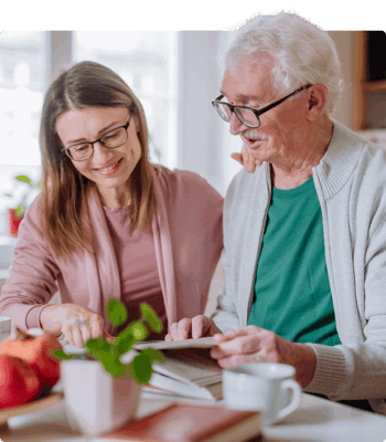 Resident and staff member engaging in an activity