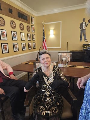 Resident dressed elegantly at a themed event in the common area