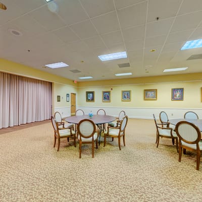 Bright common area with tables and chairs
