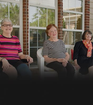 Residents enjoying time together on a porch