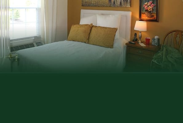 Cozy bedroom with a lamp and artwork