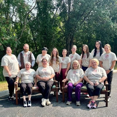 Group photo of staff members outside in Cedar Hills t-shirts