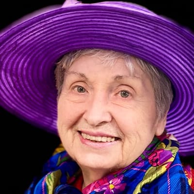 Senior woman smiling in a colorful hat