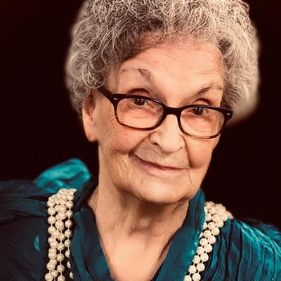 Close-up portrait of a smiling elderly woman