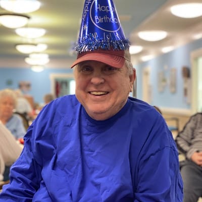 Resident celebrating a birthday in a common area