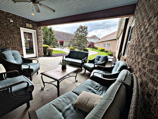 Outdoor seating area with comfortable chairs and tables