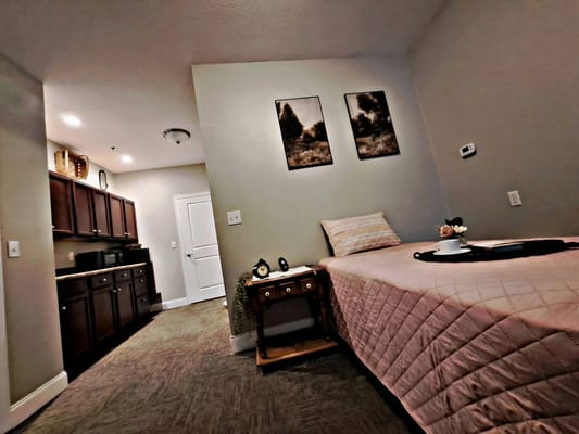 Cozy resident room with kitchenette and decor