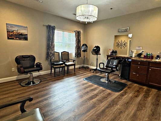 Beauty salon area with styling chairs and mirrors