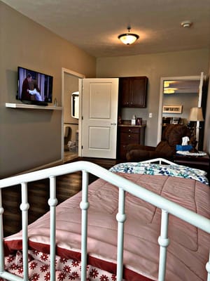 A cozy resident room with a television and personal items