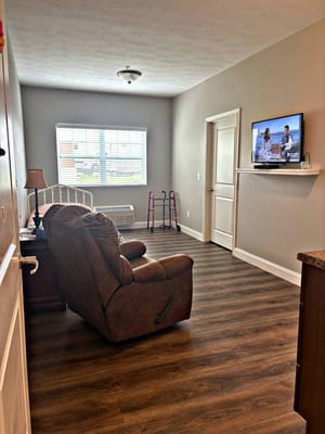 Cozy resident room with a couch and TV