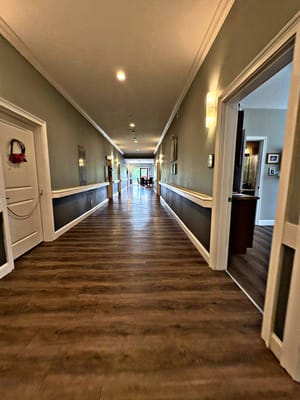 A well-lit hallway in a senior living facility