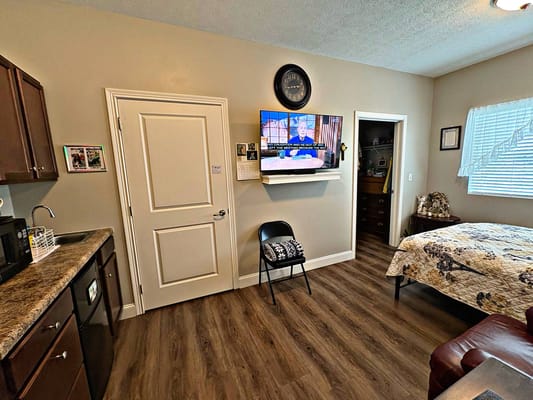 Cozy resident room with a television and kitchenette