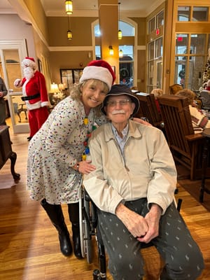 A staff member with a resident celebrating the holiday season