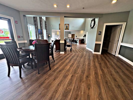Interior view of a common area with dining tables and chairs