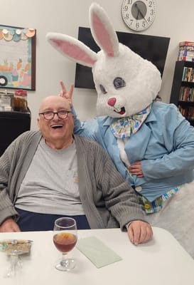 Resident enjoying a fun event with a costumed character