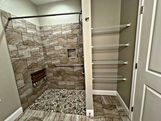 Accessible bathroom with safety features and shelving