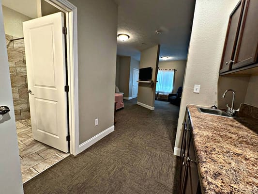 Interior view of a resident room with kitchenette