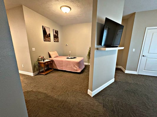 Cozy private resident room with a bed and decor