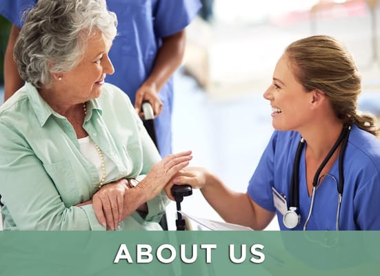 A caregiver interacting warmly with a resident