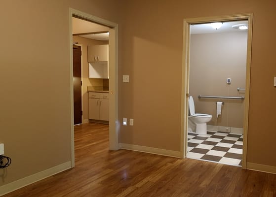 Interior view of a resident room with adjoining bathroom