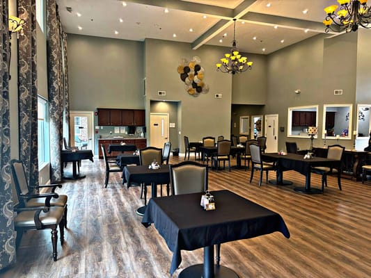 Dining area with tables and chairs in a well-lit room