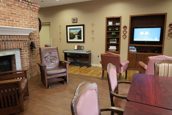 Comfortable common area with seating and a piano