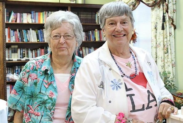 Two female residents smiling in a common area