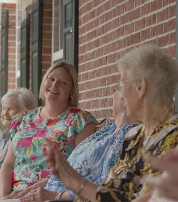 Residents socializing on a porch