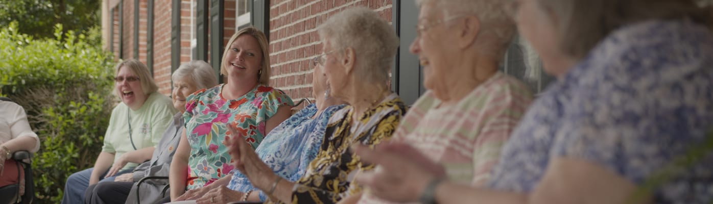 Residents enjoying time outside in a friendly atmosphere