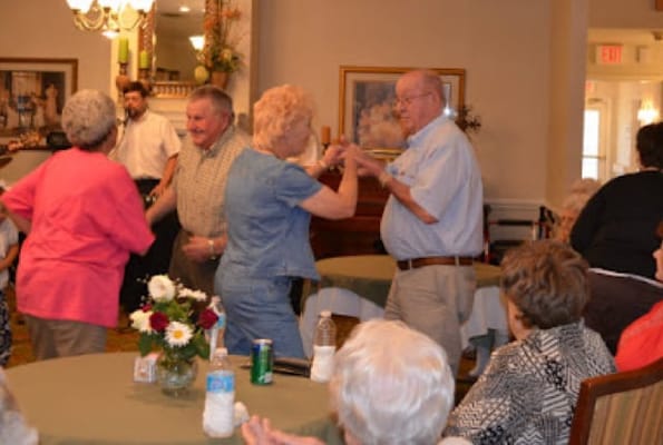 Residents dancing during a social event in a common area