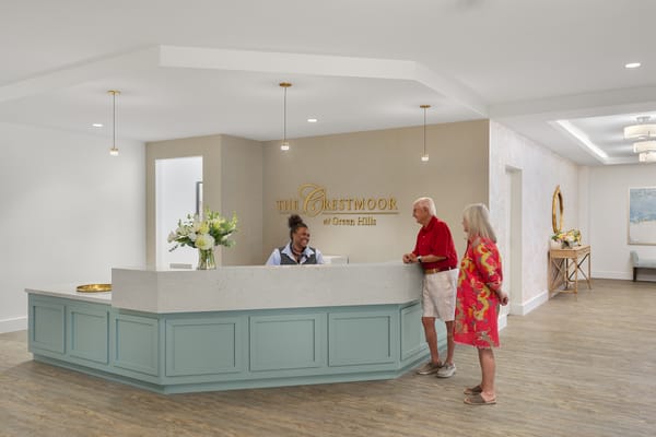 Welcoming reception area with staff and residents