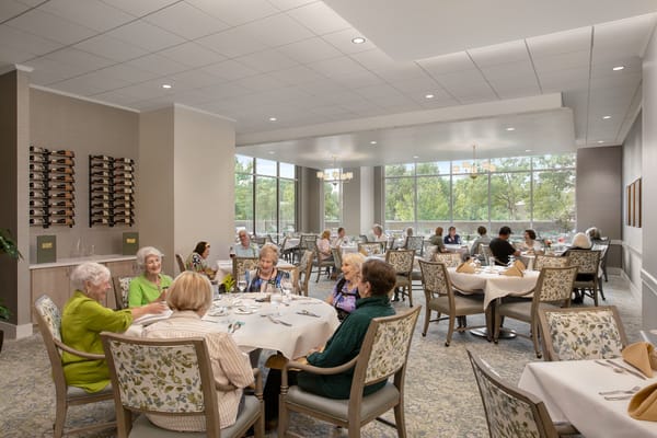 Residents enjoying a meal in the dining room