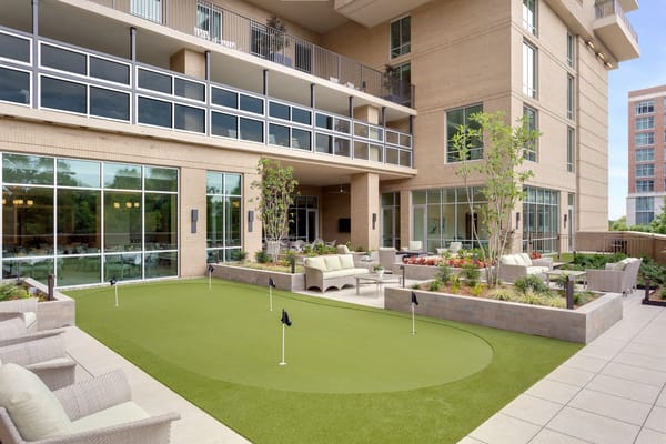 Outdoor space with putting green and comfortable seating