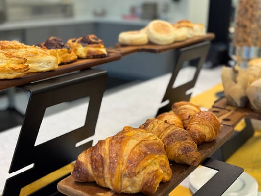 A display of fresh pastries in a dining area