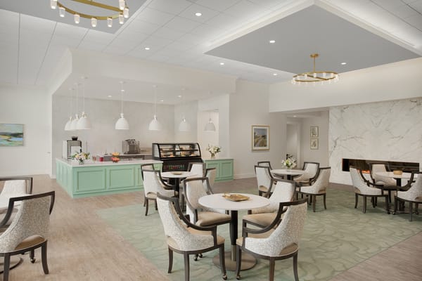 Bright dining area with tables and chairs
