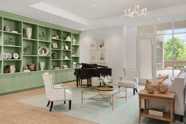 Bright common area with a piano and seating
