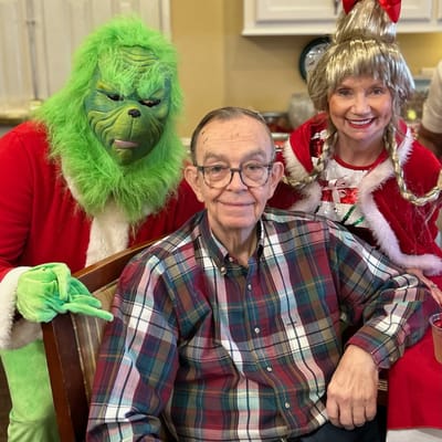 Residents enjoying a festive celebration with characters