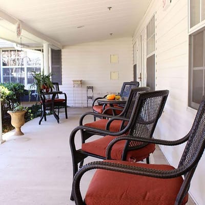 Outdoor seating area with chairs on a porch