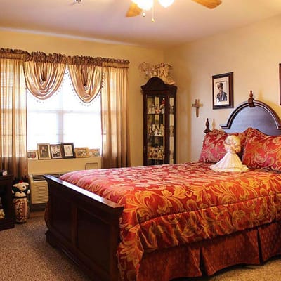 Cozy resident bedroom with floral bedding and decor