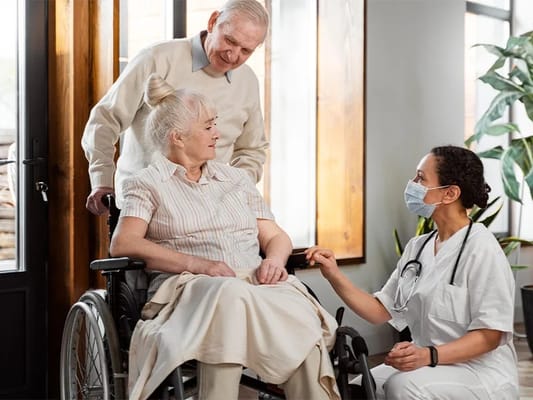 Nurse interacting with elderly resident in a care facility