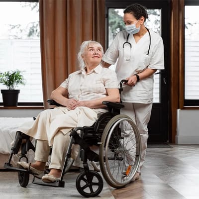 Healthcare worker assisting a resident in a wheelchair