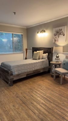 Cozy private resident room with bed and decor