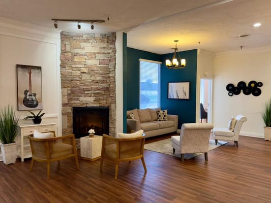 Cozy common area with seating and fireplace